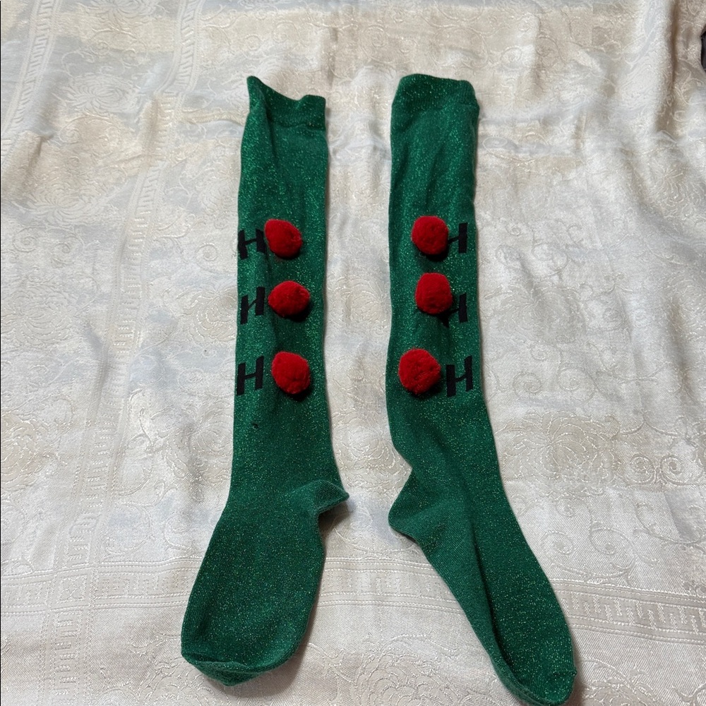 Green Knee-High Socks with Red Pom Poms